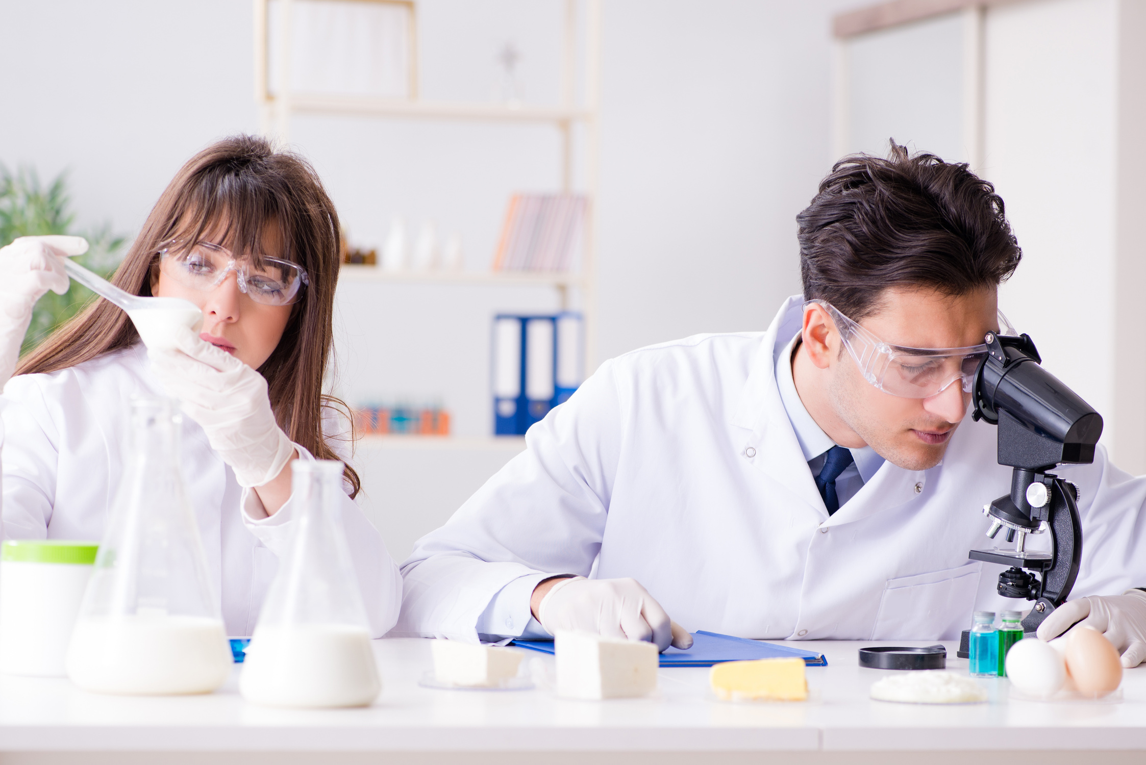 Two Lab Doctor Testing Food Products